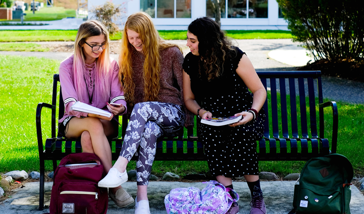 rdsy.net three female students studying on a bench on camp at Ocean County College